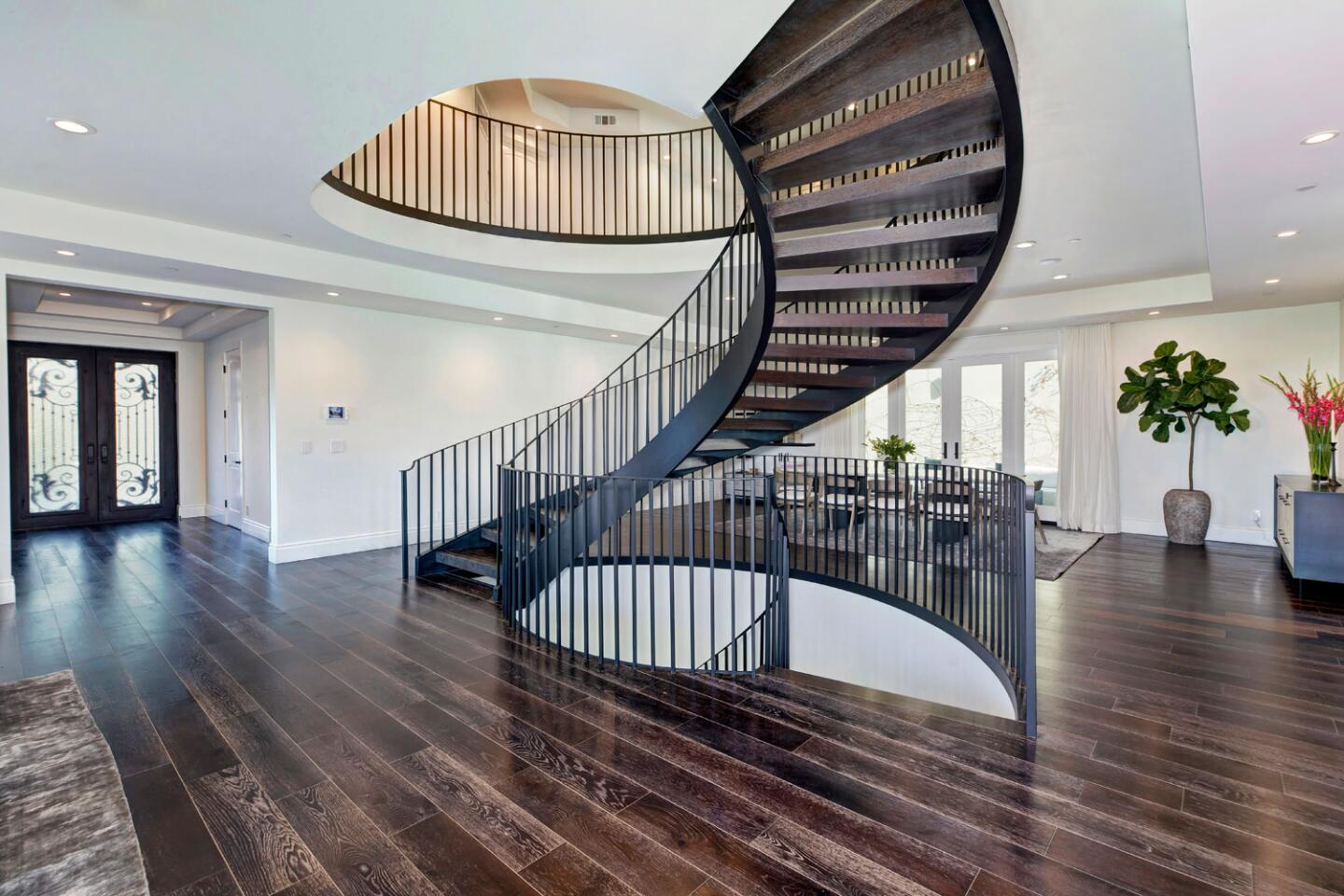 The entry with curved staircase.