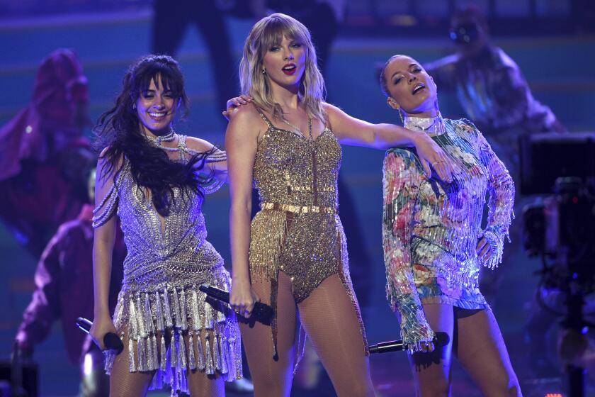 Camila Cabello, from left, Taylor Swift and Halsey perform at the American Music Awards on Sunday, Nov. 24, 2019, at the Microsoft Theater in Los Angeles. (Photo by Chris Pizzello/Invision/AP)