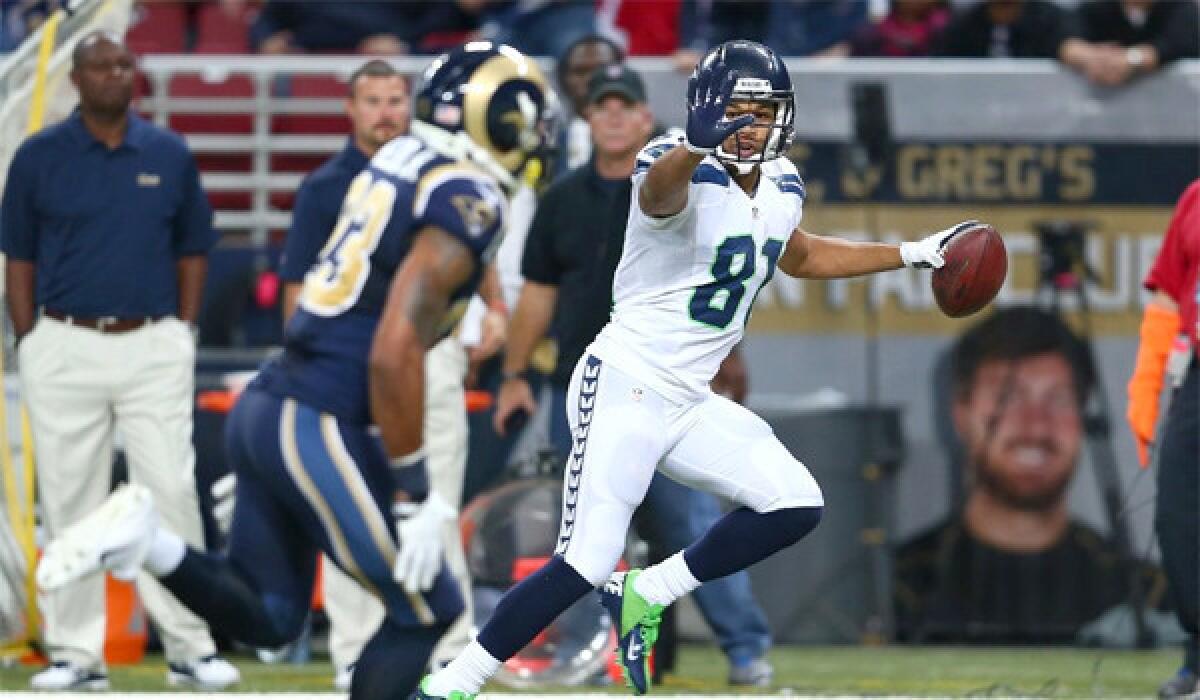 Seattle wide receiver Golden Tate tauntingly waves at a St. Louis defender during the Seahawks' 14-9 victory Monday. Tate's actions have prompted NFL officials to consider adopting stricter rules on taunting.