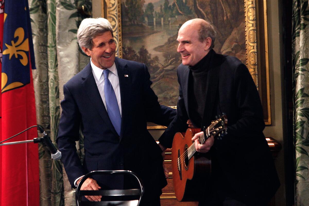 Obama's "thin" foreign policy is right for our muddled times. Above, John Kerry and James Taylor in Paris.