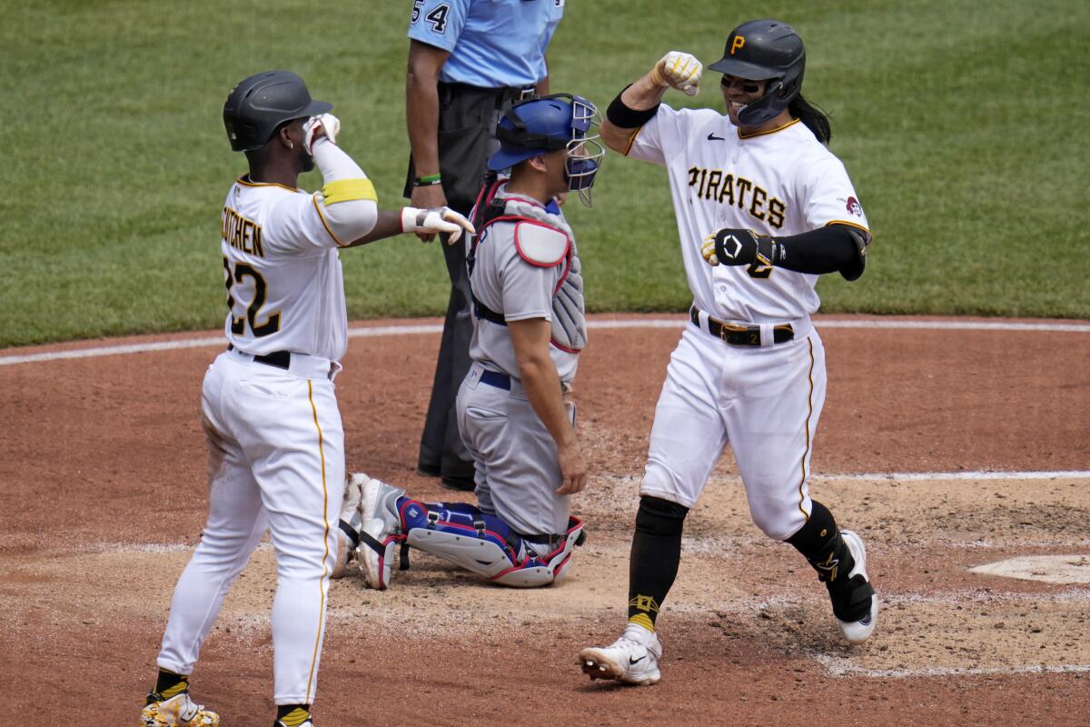 Connor Joe, right, is congratulated by Pittsburgh Pirates teammate Andrew McCutchen after hitting a home run Thursday.
