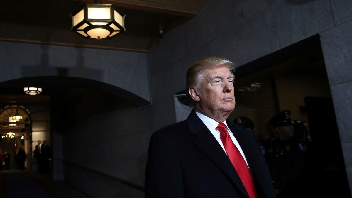 President-elect Donald Trump waits to be introduced on the West Front of the U.S. Capitol on Friday, Jan. 20, 2017, in Washington, for his inauguration ceremony. (Win McNamee/Pool Photo via AP)