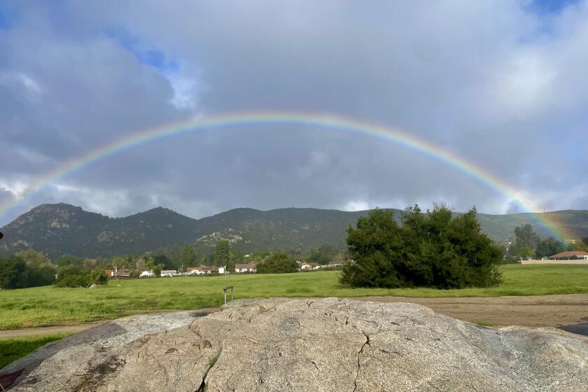 Kelly West took this photo of a full rainbow between rainstorms in front of Hummingbird Cafe in San Diego Country Estates.