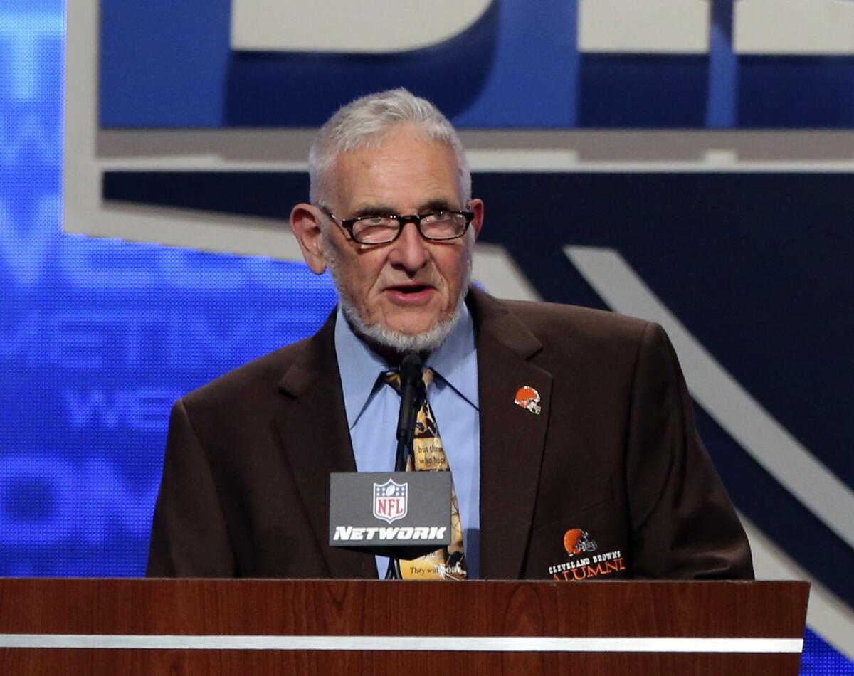 FILE - In this April 26, 2013, file photo, former Cleveland Browns player Dick Schafrath announces an NFL football draft pick during the third round at Radio City Music Hall in New York. Schafrath, an offensive tackle who blocked for Browns Hall of Fame running backs Jim Brown, Leroy Kelly and Bobby Mitchell before going into politics after retiring, has died. He was 84. The team said Schafrath died on Sunday, Aug. 15, 2021. No cause of death was given. (AP Photo/Mary Altaffer, File)