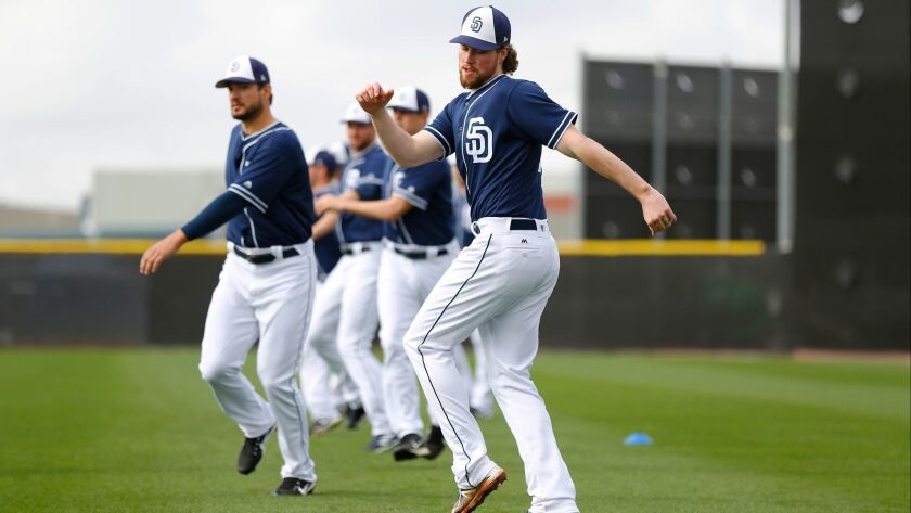 Padres pitcher Carter Capps stretches before the first practice of spring training.