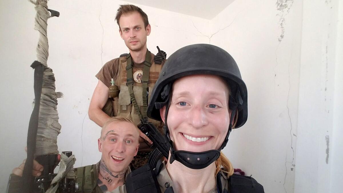 Los Angeles Times reporter Molly Hennessy-Fiske with Kevin Howard, center, a former Marine from San Francisco, and fellow U.S. volunteer Taylor Hudson of Pasadena, in Raqqah, Syria, in 2017.
