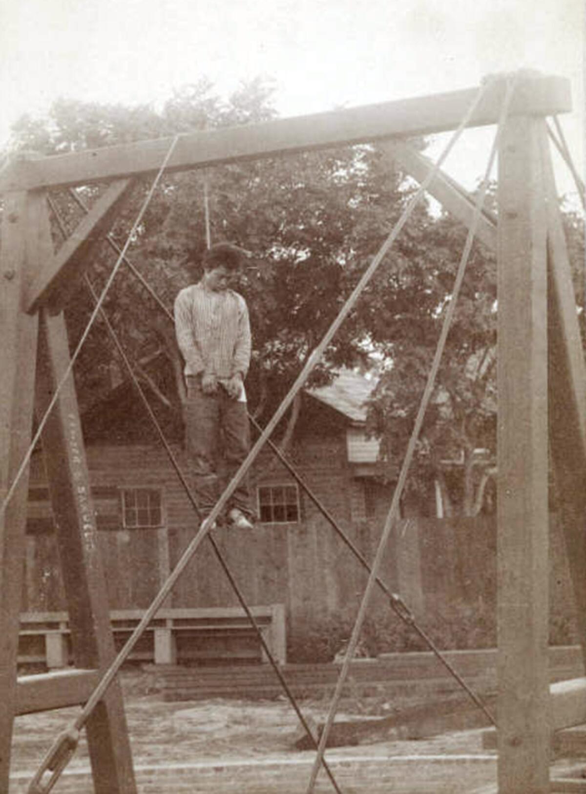 A man is hanged from from a scaffolding