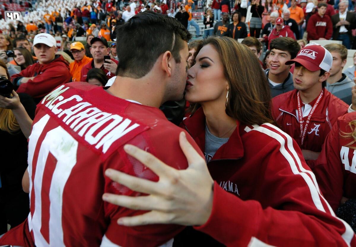 Katherine Webb kisses Alabama quarterback AJ McCarron after the Crimson Tide's win over Tennessee last month.