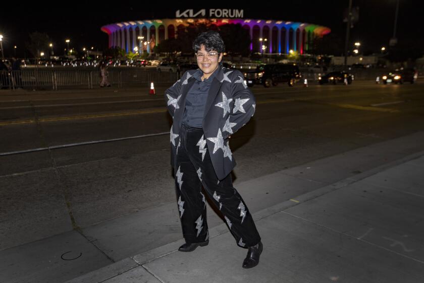 Inglewood, CA - October 23 Harry Styles fan Alondra "Ash" Sandoval poses for portraits across the street from the Kia Forum prior to Harry Styles concert Sunday, Oct. 23, 2022 in Inglewood, CA.(Brian van der Brug / Los Angeles Times)