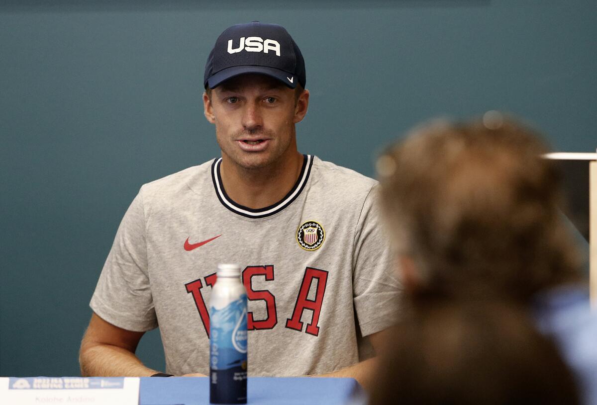 Team USA surfer Kolohe Andino, of San Clemente, answers a question during a press conference.  
