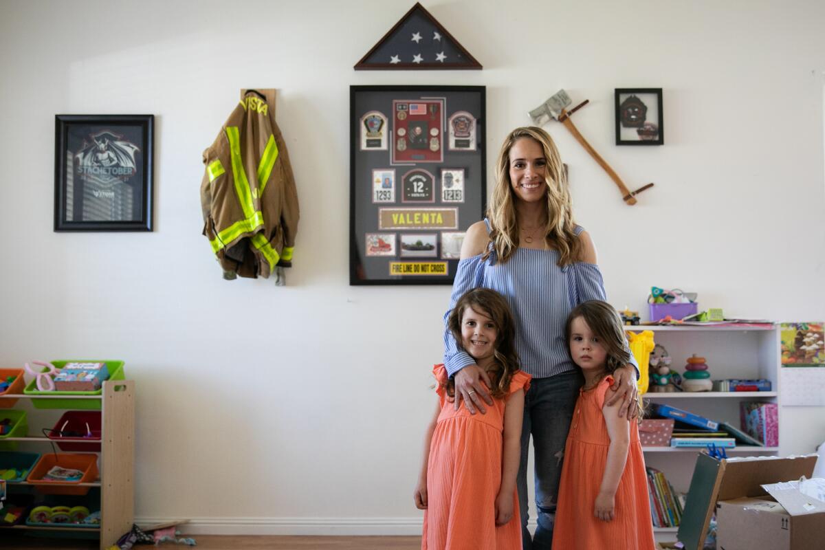 Caylie Valenta poses for a portrait with her daughters Lilly, 5, and Grace, 3, at their home on April 18 in Temecula.  