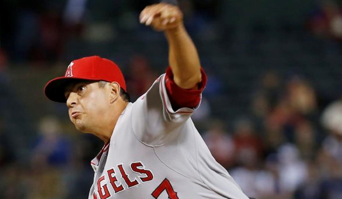 Angels reliever Cesar Ramos throws a pitch against the Rangers earlier this month.