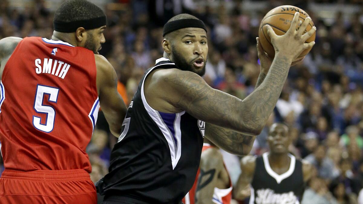 Kings center DeMarcus Cousins, working inside against Clippers forward Josh Smith, will present a challenge for the Lakers on Friday night.