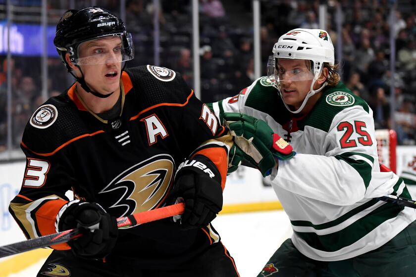 ANAHEIM, CALIFORNIA - NOVEMBER 05: Jakob Silfverberg #33 of the Anaheim Ducks is pushed by Jonas Brodin #25 of the Minnesota Wild during the first period at Honda Center on November 05, 2019 in Anaheim, California. (Photo by Harry How/Getty Images) ** OUTS - ELSENT, FPG, CM - OUTS * NM, PH, VA if sourced by CT, LA or MoD **