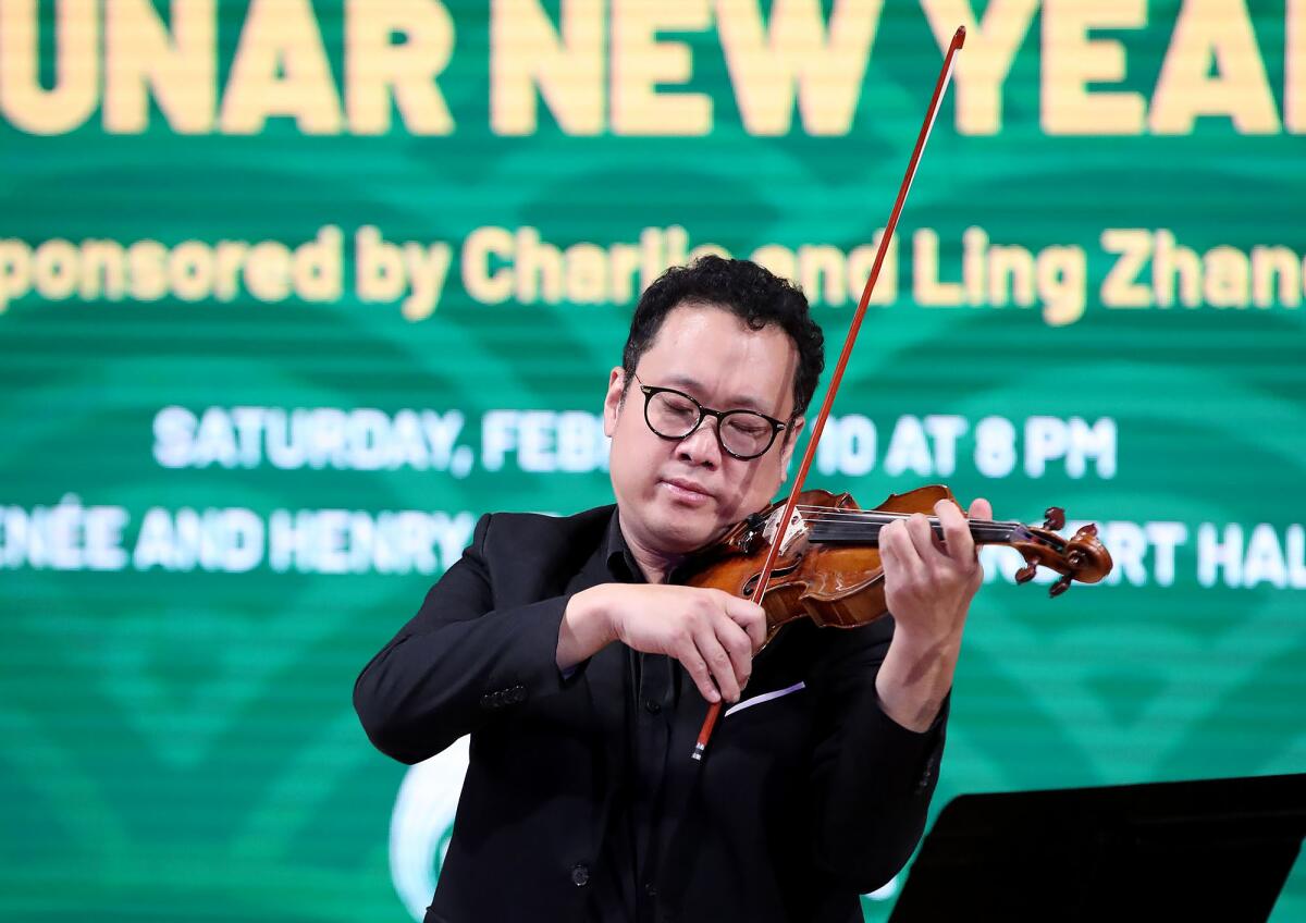 Violinist Dennis Kim performs concert music for the seventh annual Lunar New Year celebration concert.