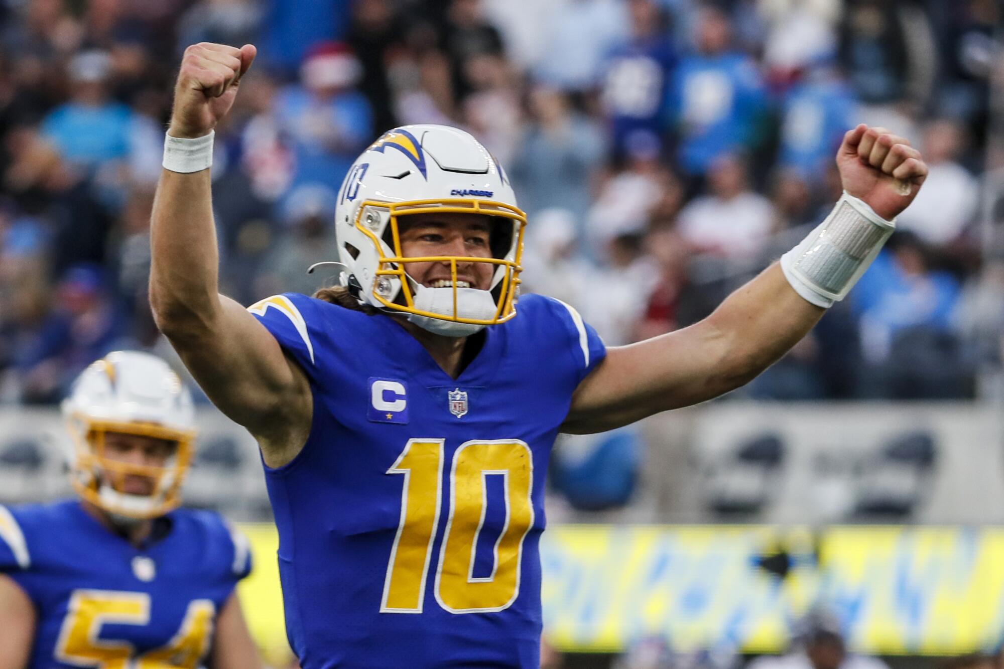 Chargers quarterback Justin Herbert celebrates after throwing a 59-yard touchdown pass in the second quarter.