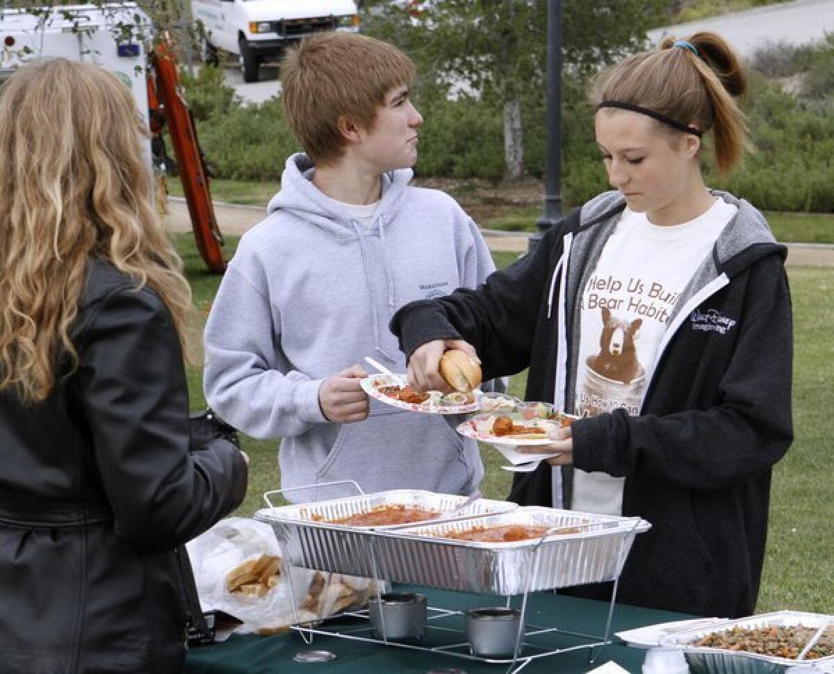 Local kids Lucas Martos, left, and Jessy Shelton, right, tried out some of the meatball varieties offered at the 1st annual meatball tasting event at Deukmejian Wilderness Park in Glendale on Saturday, Nov. 23, 2013. The event was a fundraiser for the city of Glendale Rose Float which includes a rendition of Meatball the bear. Restaurants participating in the event included George's Cucina Italiana, Far Niente, Mario's Italian Deli, Wooden Fork, Giuseppe's, Frank's Famous Kitchen & Catering, Casa Cordoba CafÃ‚Â¿.