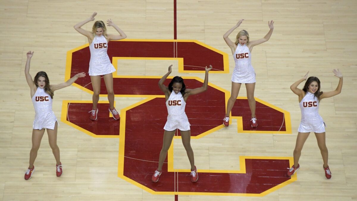USC Song Girls dance during a game against Long Beach State in November.