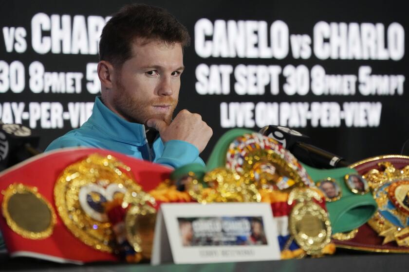Canelo Alvarez, of Mexico, listens during a news conference Wednesday, Sept. 27, 2023, in Las Vegas. Alvarez is scheduled to fight Jermell Charlo in a super middleweight title boxing match Saturday in Las Vegas. (AP Photo/John Locher)