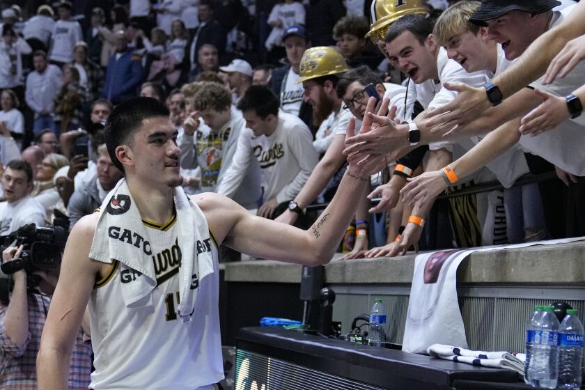 Purdue center Zach Edey (15) greets fans as he leaves the floor following an NCAA college basketball game against Michigan State in West Lafayette, Ind., Sunday, Jan. 29, 2023. Purdue defeated Michigan State 77-61. (AP Photo/Michael Conroy)