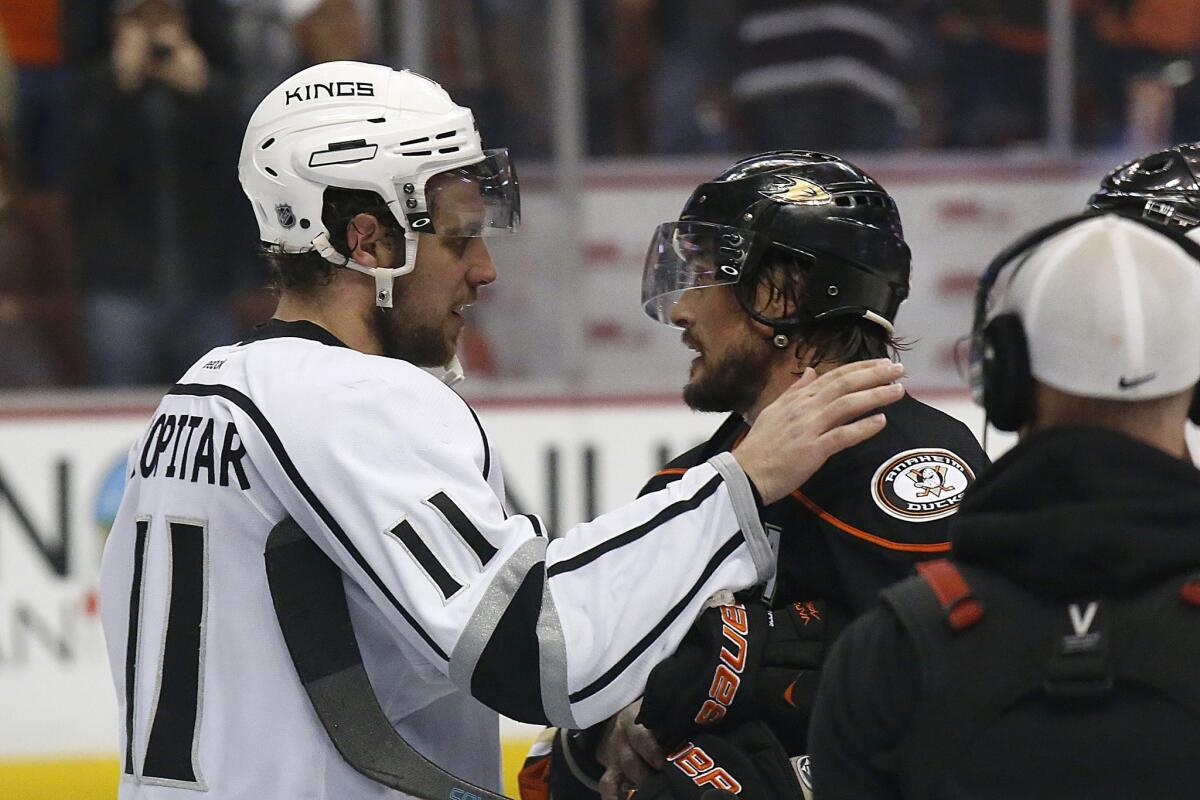 Kings center Anze Kopitar embraces Ducks right wing Teemu Selanne, who played his final NHL game in a 6-2 loss on Friday night at Honda Center in Anaheim. Selanne is retiring at age 43 after 23 seasons.