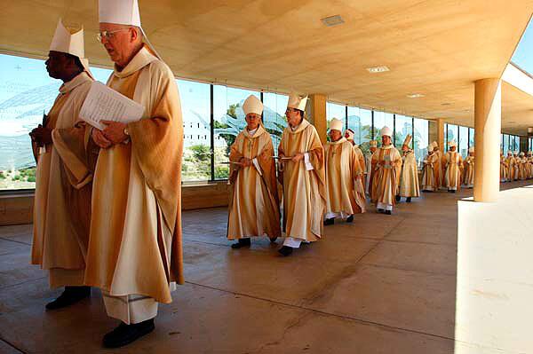 Roman Catholic priests arrive for a welcoming Mass at the Cathedral of Our Lady of the Angels marking the start of Coadjutor Archbishop Jose H. Gomez's ministry in Los Angeles. See full story