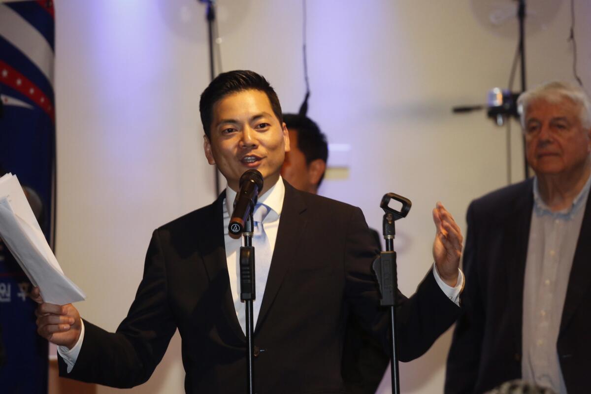 Robert Lee Ahn addresses an audience on the night of the primary election.