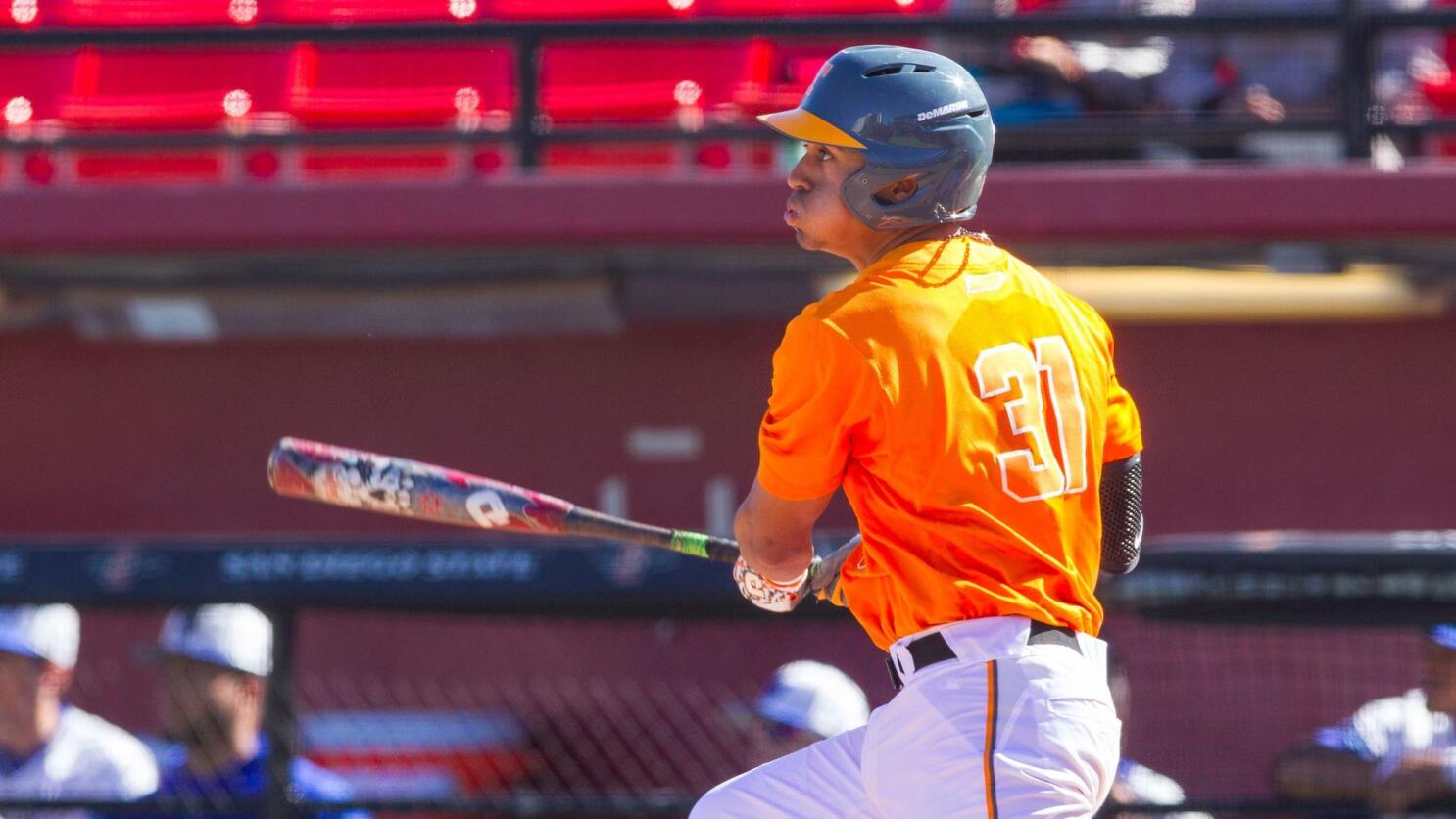 Tennessee catcher Benito Santiago (31) connects for a hit during