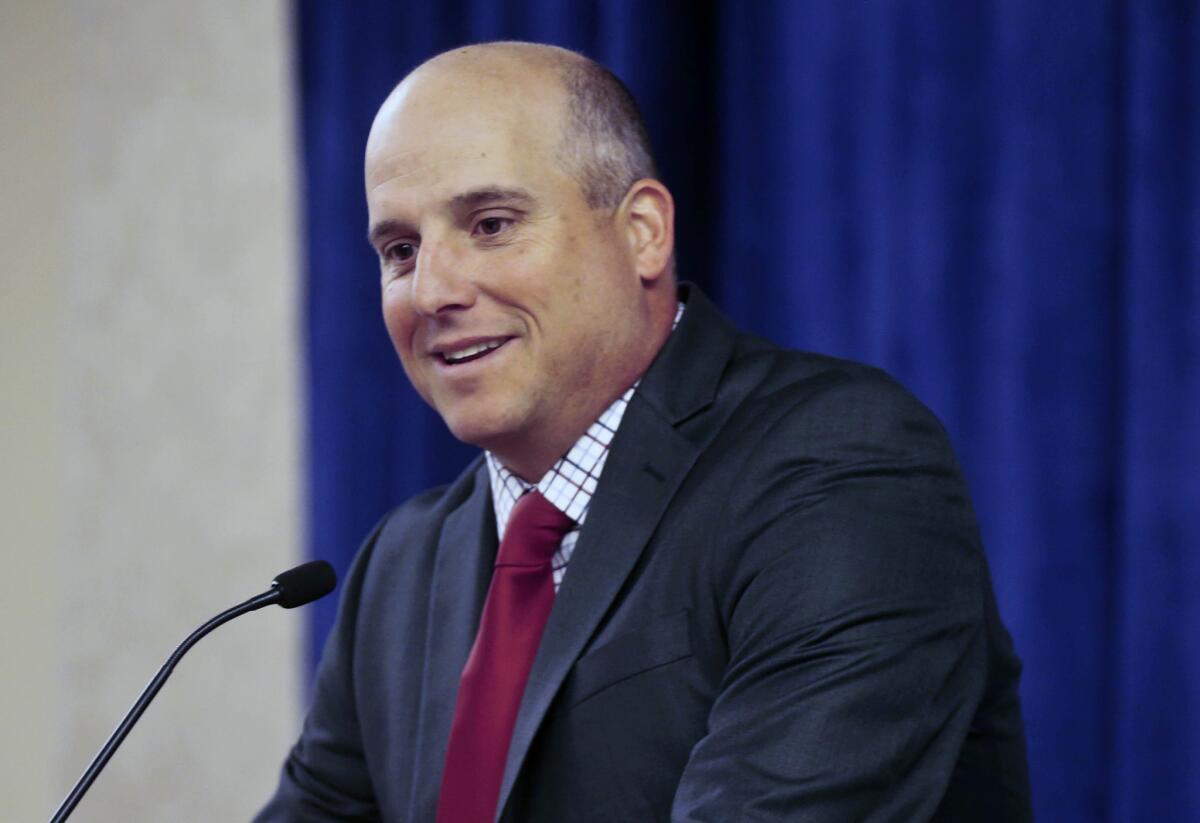 USC Coach Clay Helton answers questions during a news conference prior to the Holiday Bowl in San Diego.