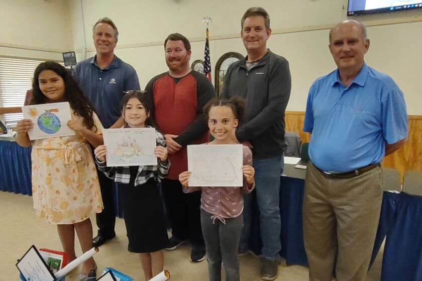Water Awareness Poster Contest winners shown with directors are, from left, Ashley Rincon, Tae-hee Smitley and Elle McNett. 