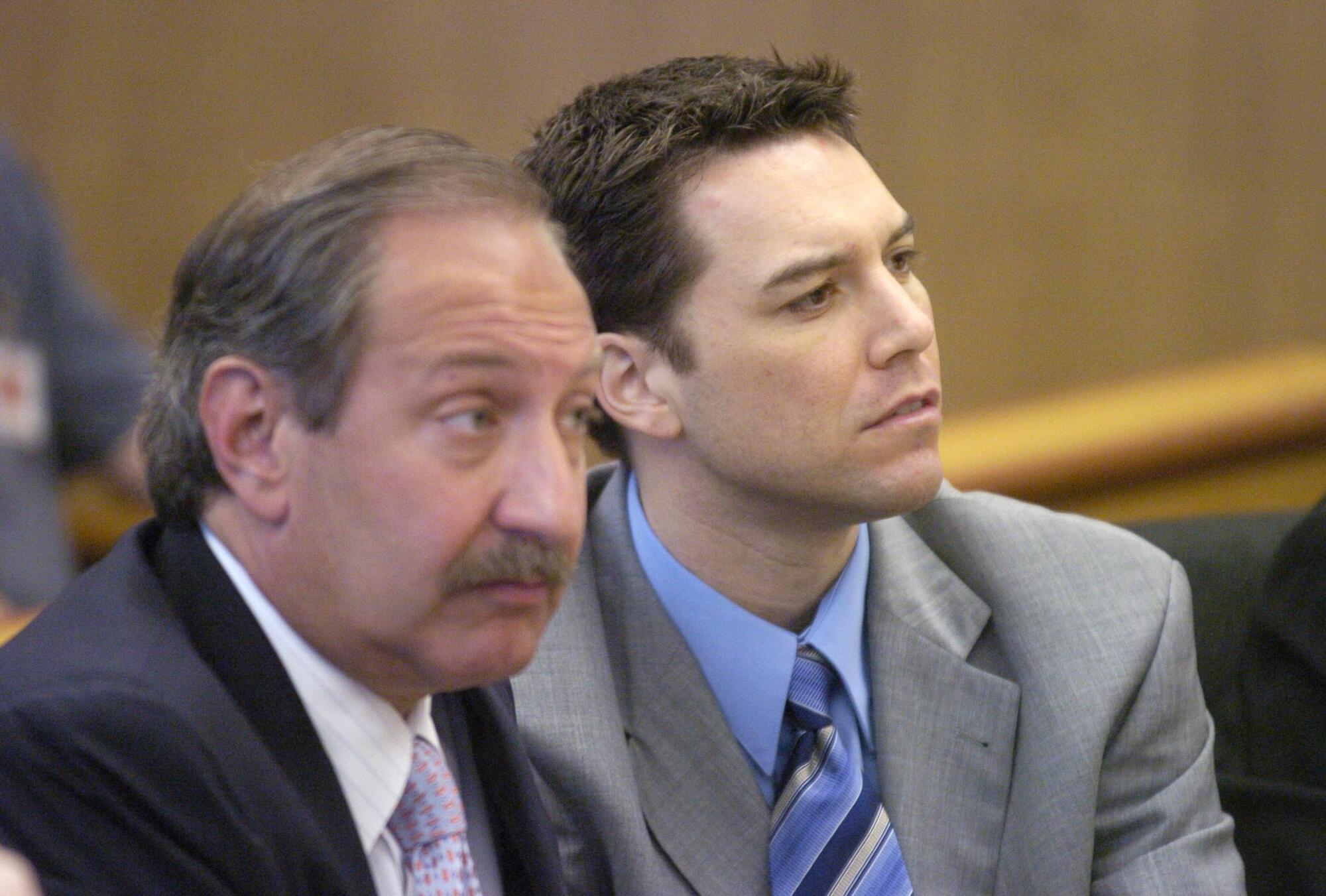 July 2004 photo of attorney Mark Geragos, left, and Scott Peterson in Redwood City.