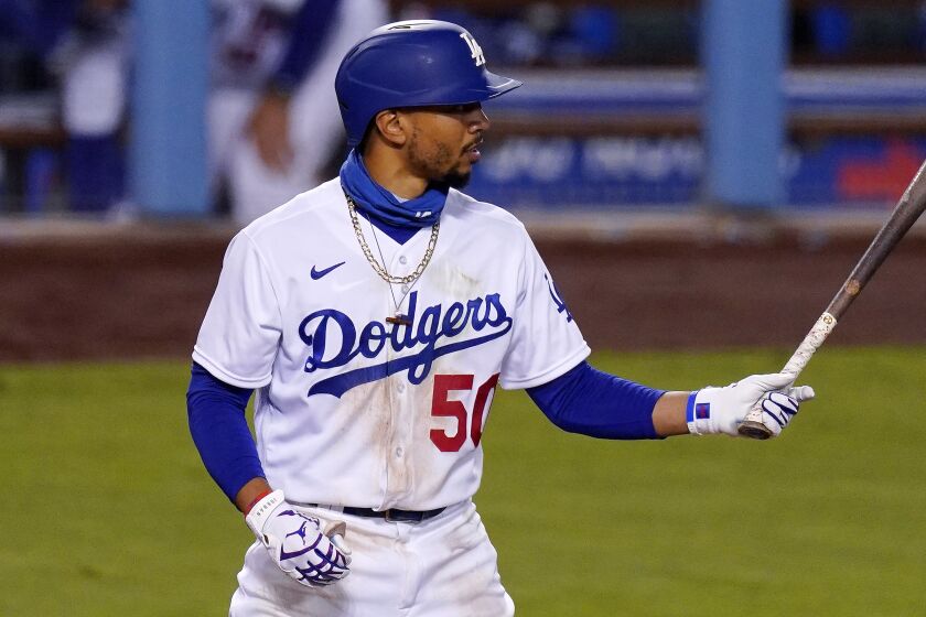 Los Angeles Dodgers' Mookie Betts bats during a baseball game against the San Diego Padres.