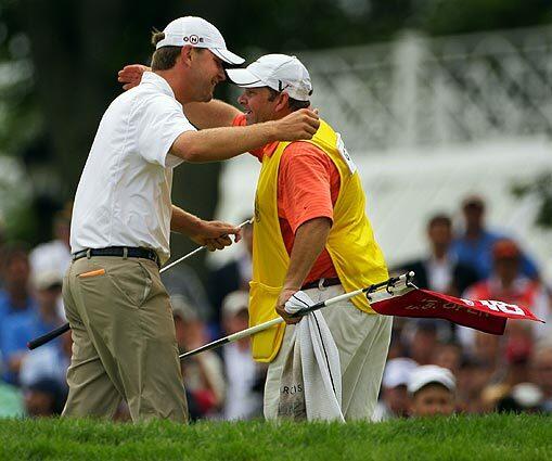 Lucas Glover, left, hugs his caddie Dan Cooper after winning U.S. Open Golf Championship at Bethpage State Park's Black Course in Farmingdale, N.Y.