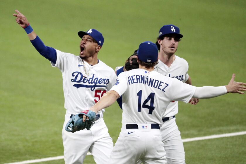  Los Angeles Dodgers celebrate after Cody Bellinger robbed Fernando Tatis Jr. of a two run homer
