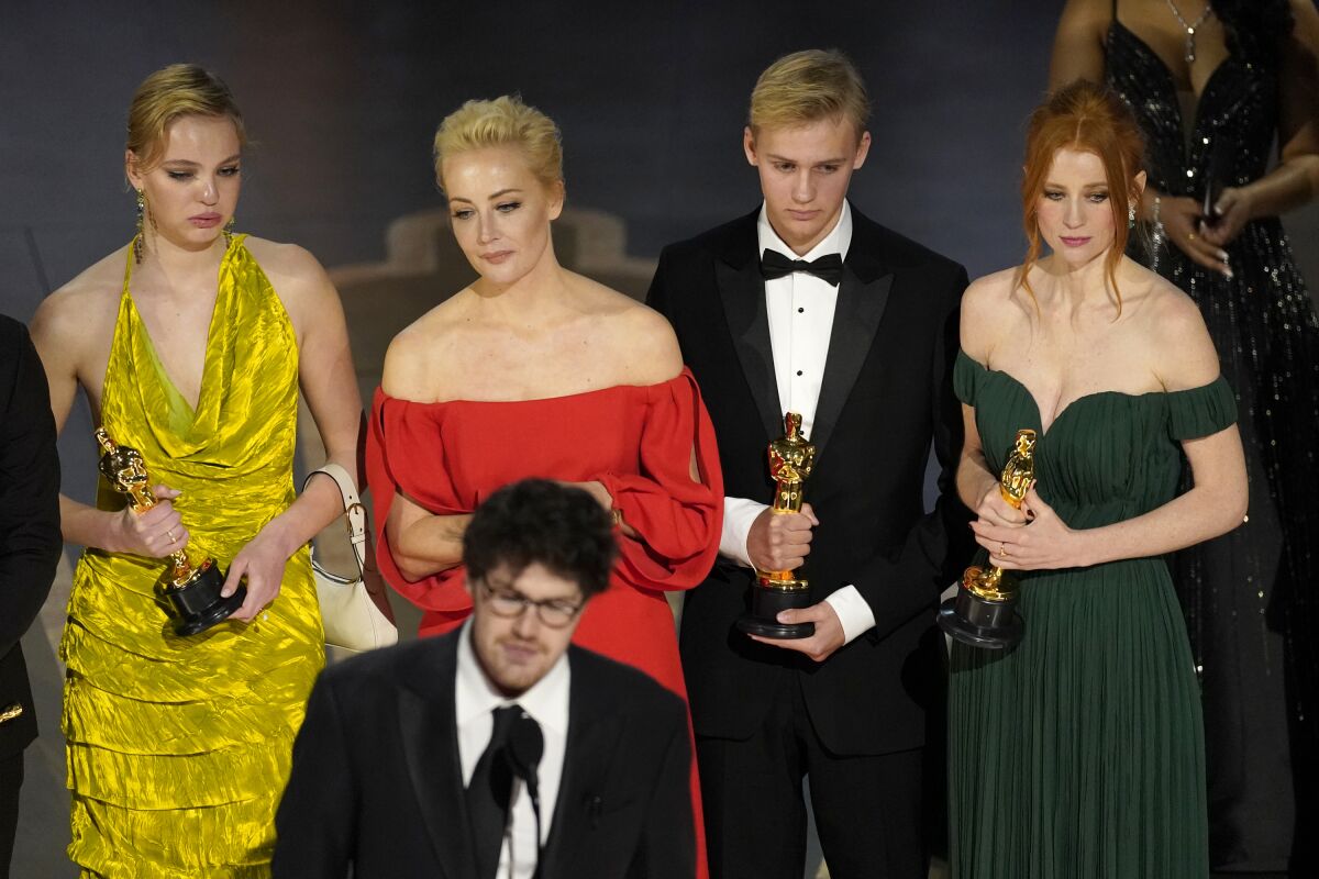 Daniel Roher and the members of the crew from "Navalny" accept the award for best documentary feature film at the Oscars on Sunday, March 12, 2023, at the Dolby Theatre in Los Angeles. (AP Photo/Chris Pizzello)