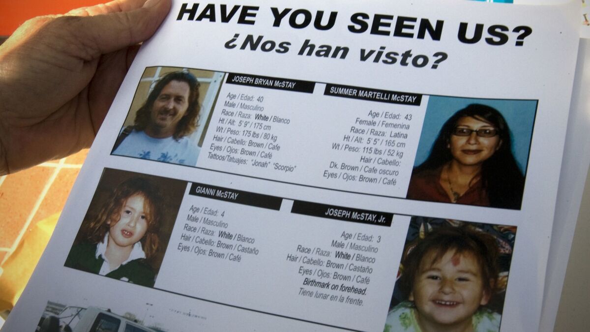 This April 2010 file photo shows a flier distributed by volunteers seeking information on the then-missing McStay family.