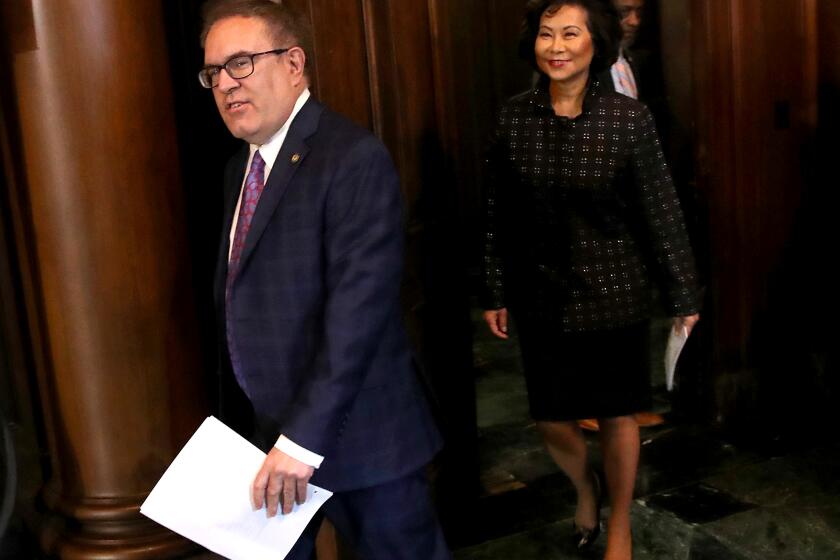 WASHINGTON, DC - SEPTEMBER 19: Environmental Protection Agency Administrator Andrew Wheeler (L) and Transportation Secretary Elain Chao (R) arrive for a policy announcement at EPA headquarters September 19, 2019 in Washington, DC. Wheeler and Chao announced that the Trump administration would prohibit California from setting its own fuel economy standards, with Wheeler saying “Federalism does not mean that one state can dictate standards for the rest of the country”. (Photo by Win McNamee/Getty Images)