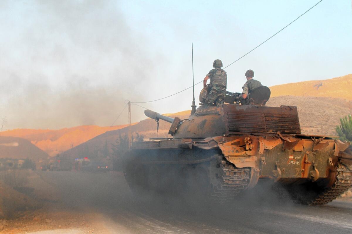 A Lebanese tank heads toward the fighting in Arsal on Aug. 2.