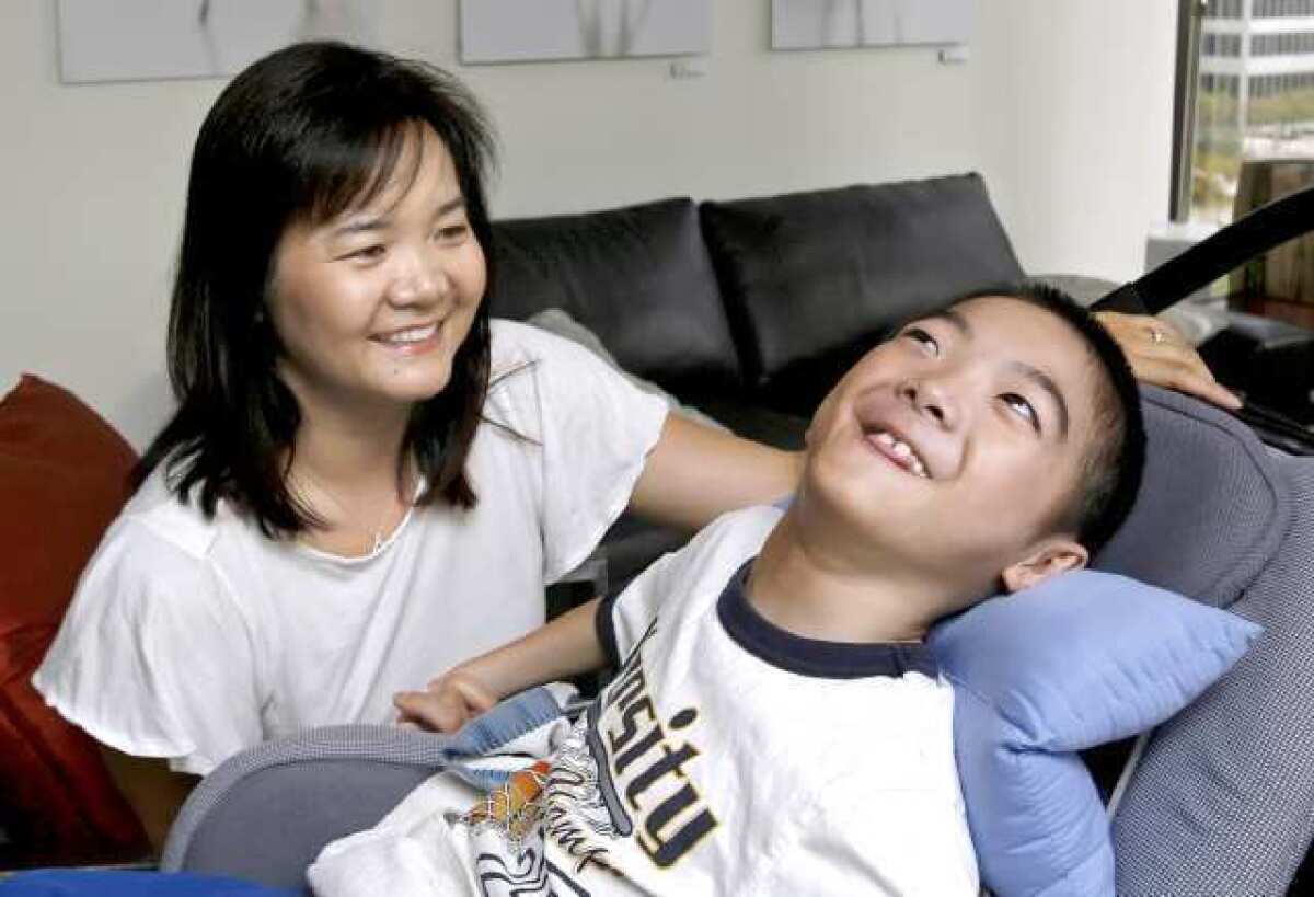 Nancy Leung, with her son Aidan in 2011. Aidan suffers from brain damage he received shortly after his birth at Verdugo Hills Hospital.