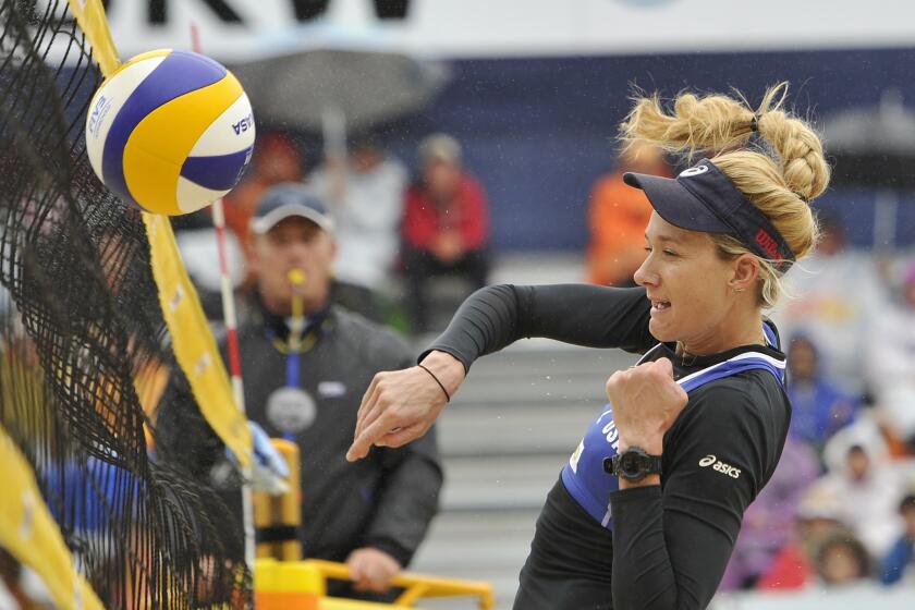 Kerri Walsh Jennings attacks during a match at the FIVB Gstaad Grand Slam on July 10. Walsh Jennings and her teammate April Ross have advanced to the elimination rounds of the Asics World Series of Beach Volleyball in Long Beach.
