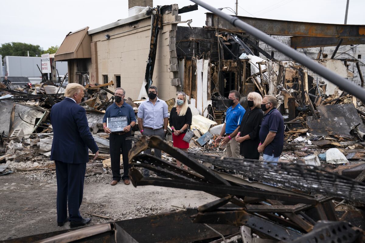 President Trump tours Kenosha, Wis., in the aftermath of protests against the police shooting of Jacob Blake in August.