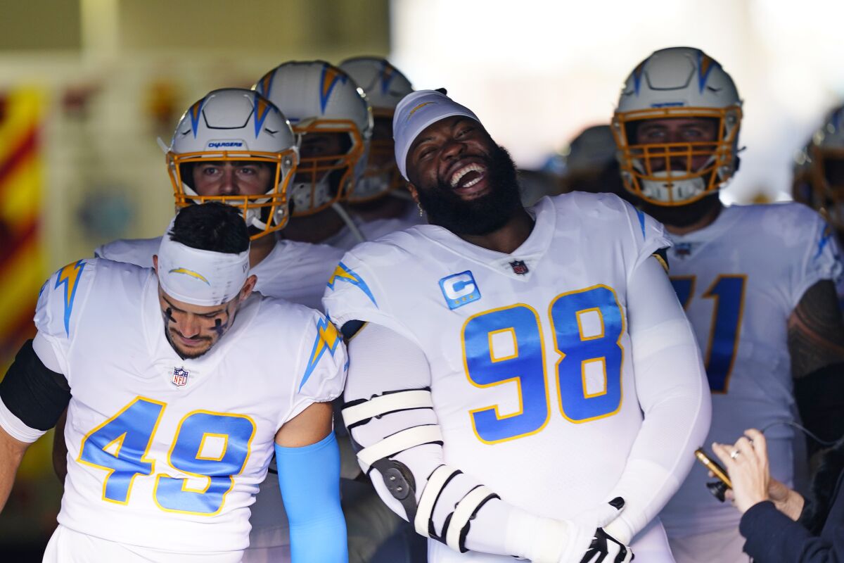 Chargers defensive tackle Linval Joseph (98) and teammates wait to run onto the field