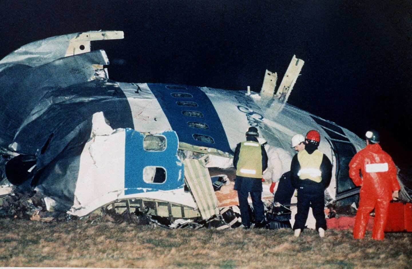 Rescue workers examine the nose of Pan Am flight 103 near the town of Lockerbie, Scotland,after a bomb aboard exploded and killed 270 people.