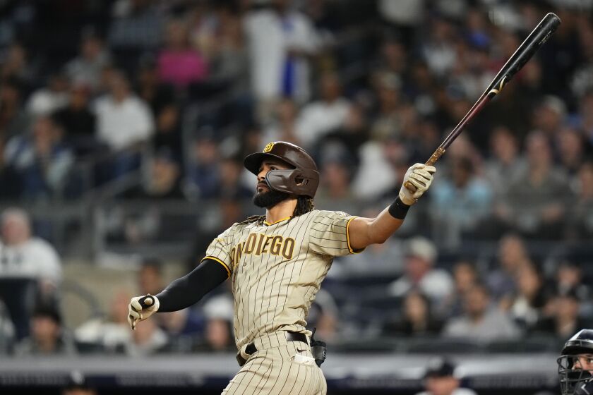 San Diego Padres' Fernando Tatis Jr. follows through on a two-run home run during the sixth inning of a baseball game against the New York Yankees, Friday, May 26, 2023, in New York. (AP Photo/Frank Franklin II)