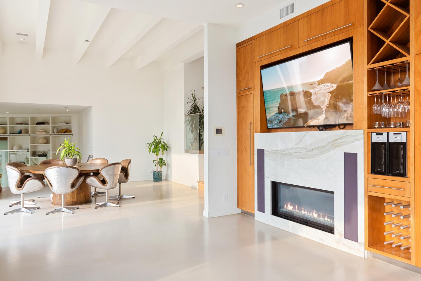 High ceilings, a polished concrete floor and a marble fireplace with built in minibar.