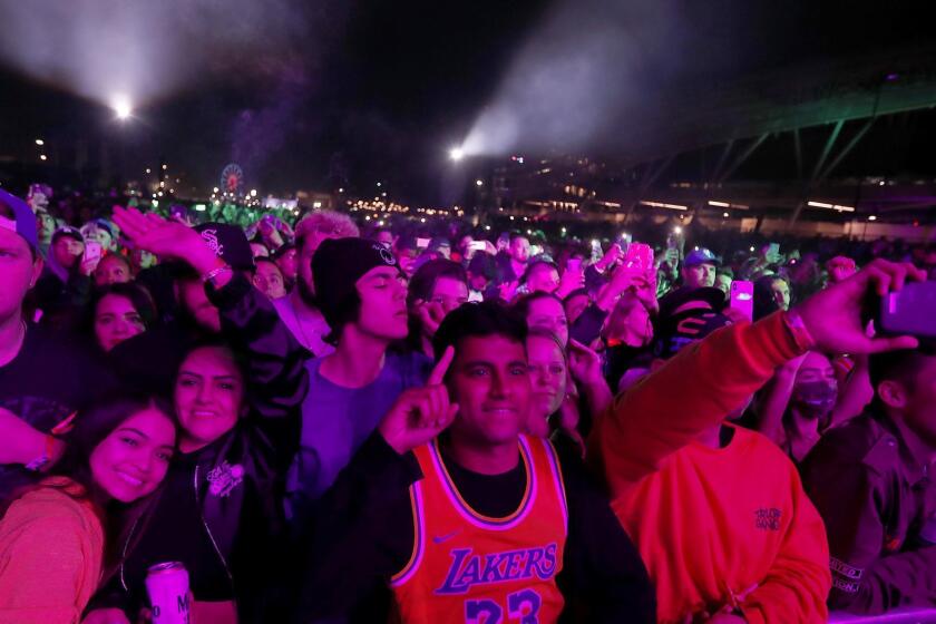LOS ANGELES, CALIF. - DEC. 14, 2018. Fans enjoy hip hop during Rolling Loud at Exposition Park in Los Angeles on Friday night, Dec. 14, 2018. (Luis Sinco/Los Angeles Times)