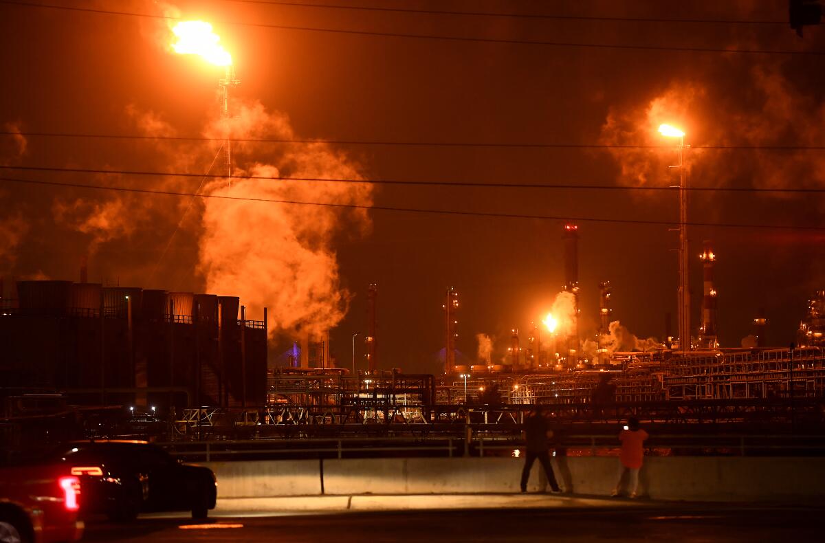 Flames and fumes at the Marathon oil refinery in Carson.