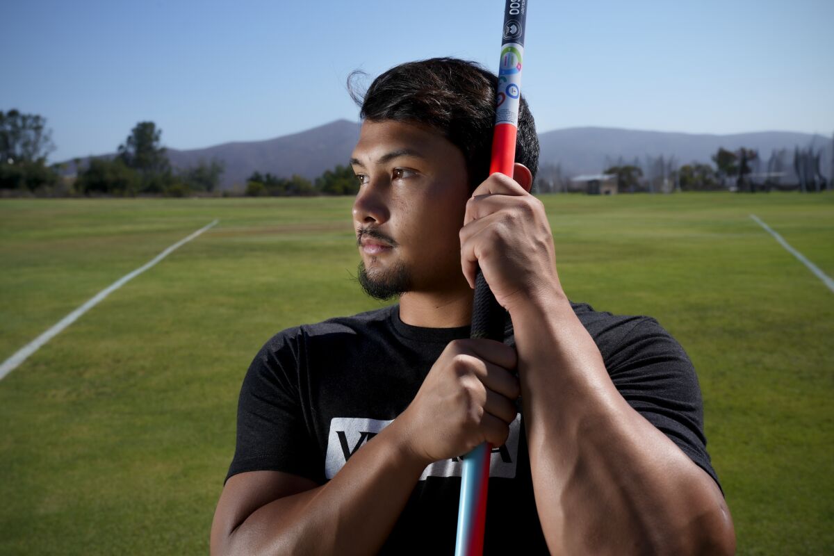 U.S. Paralympian Justin Phongsavanh holds the world record for men's adaptive javelin-throwing.