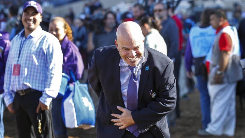Trainer Peter Miller bows for the cameras after his horse Roy H won Breeders' Cup Sprint last year at Del Mar racetrack. It was Miller's second Cup win of the day, a feat he repeated this year at Churchill Downs.