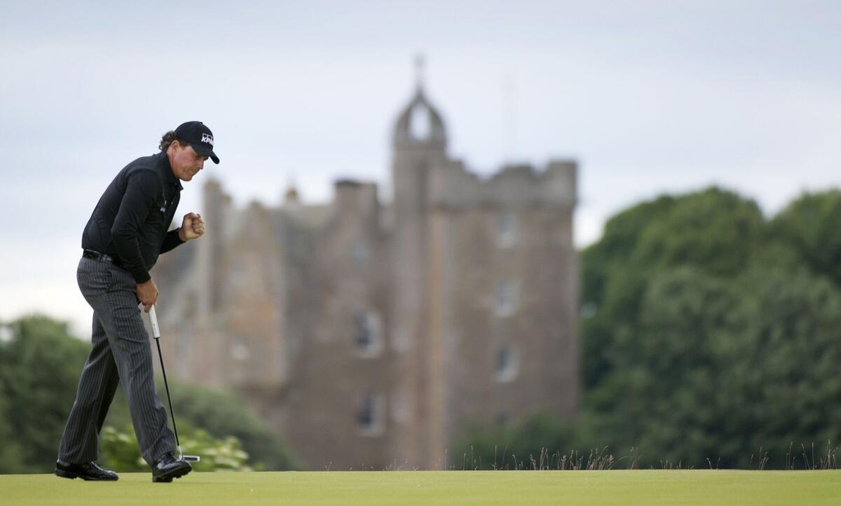 Phil Mickelson reacts after making a birdie putt on the fourth hole at Castle Stuart Golf Course on Sunday on his way to winning the Scottish Open.